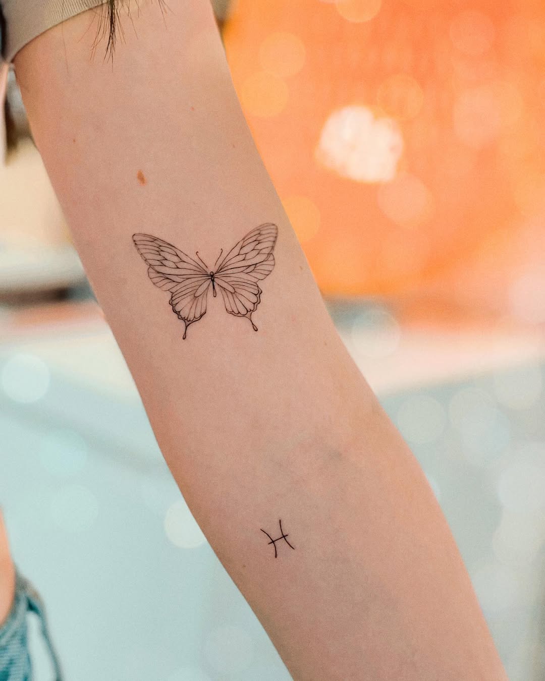 Elegant Pisces and Butterfly Tattoo Design