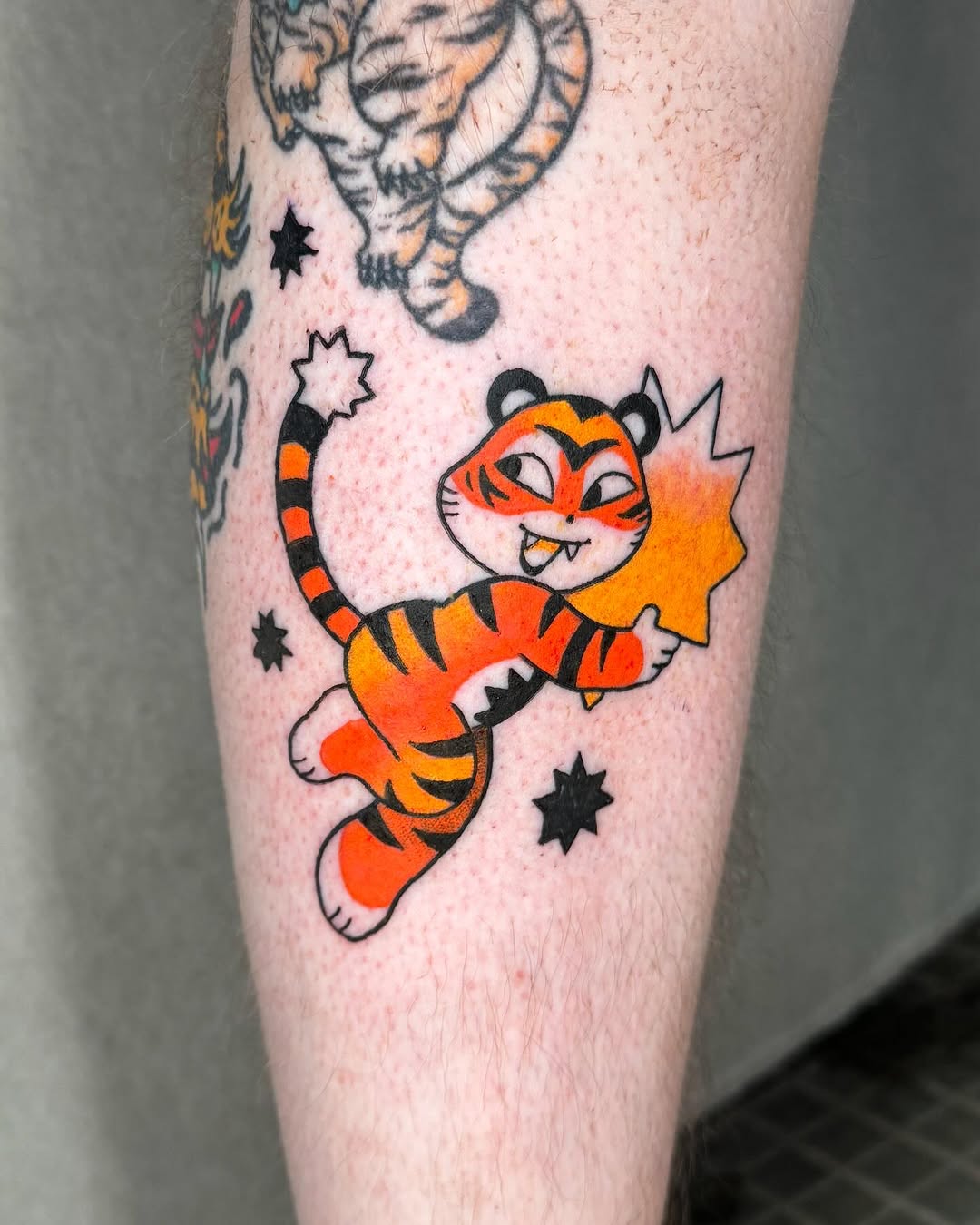 Fun and vibrant cartoon tiger tattoo design
