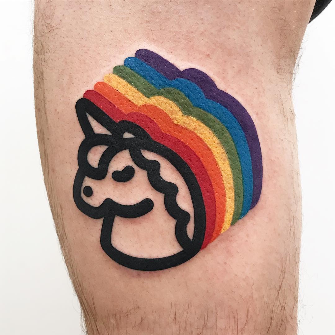 Colorful unicorn tattoo with vibrant rainbow hues