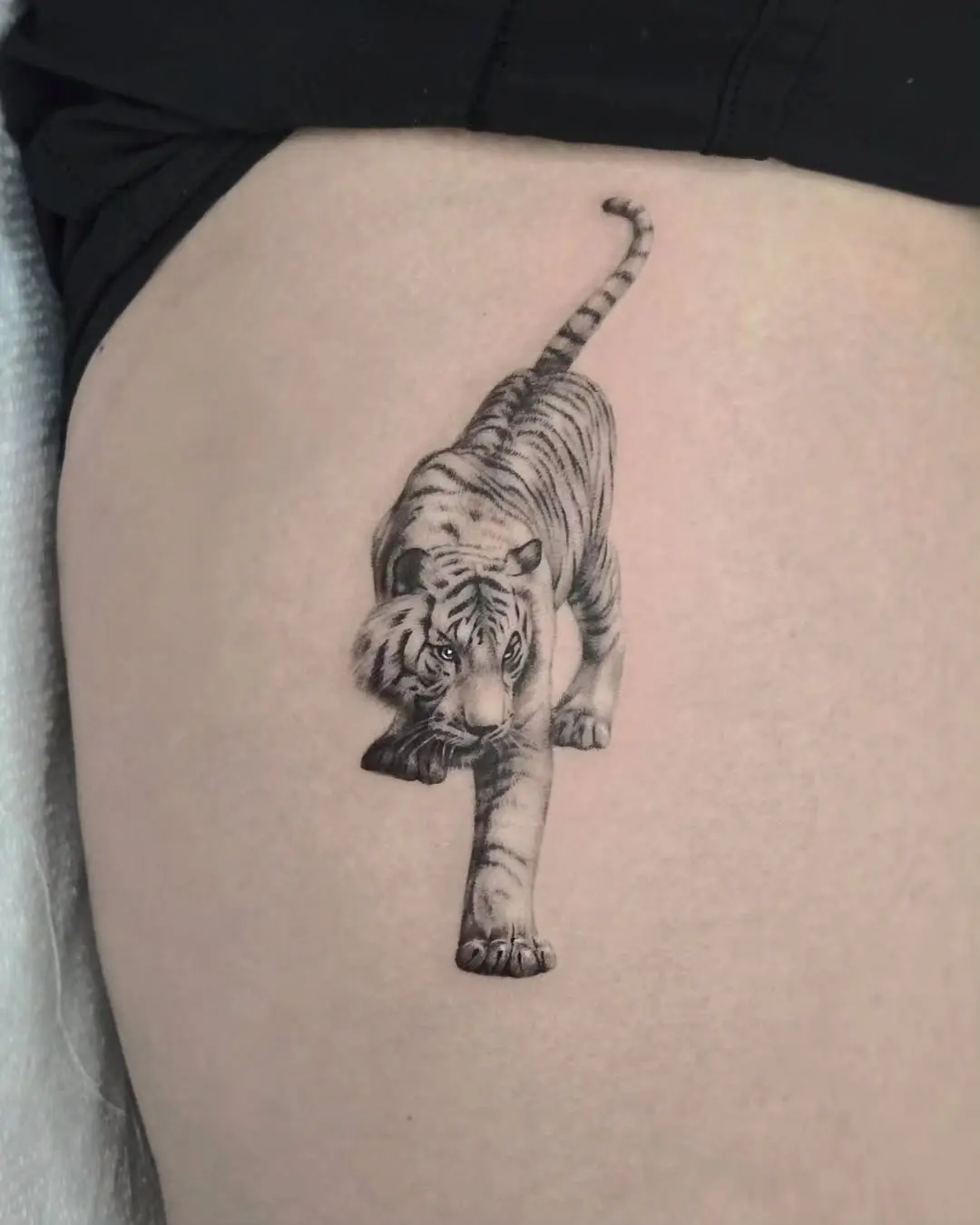 Stunning white tiger tattoo in motion