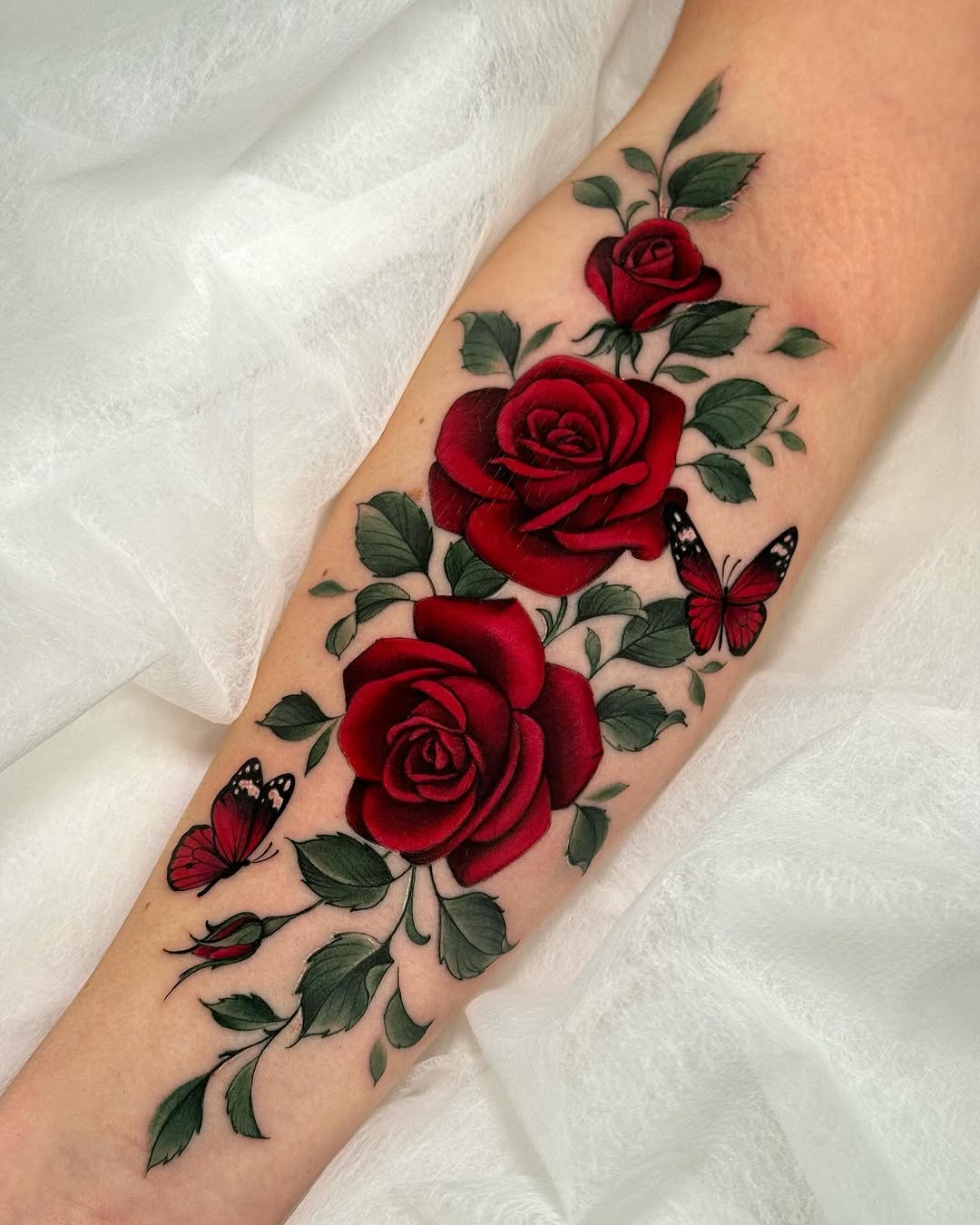 Elegant red roses with delicate butterflies design