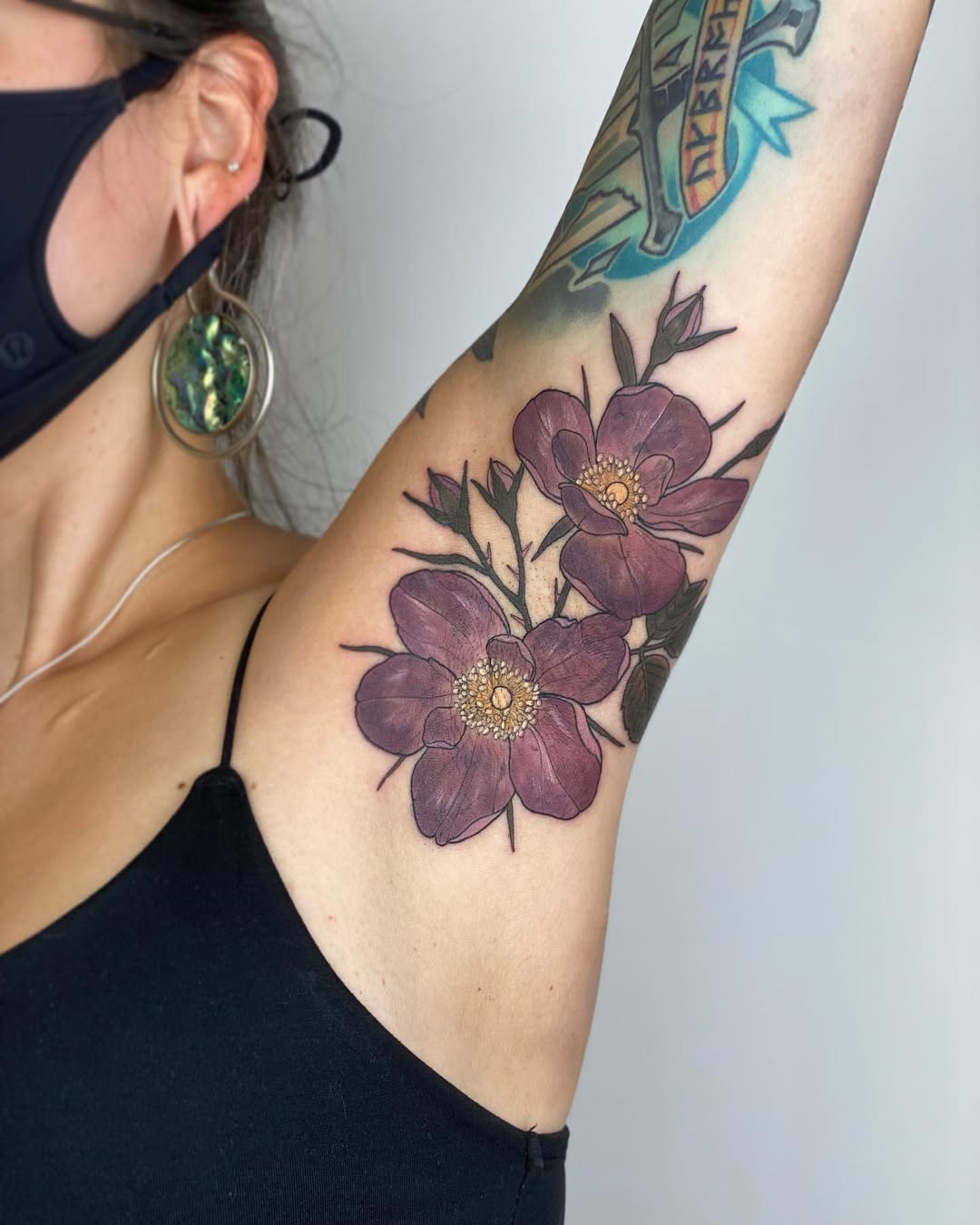 Stylish rose tattoos on armpit area