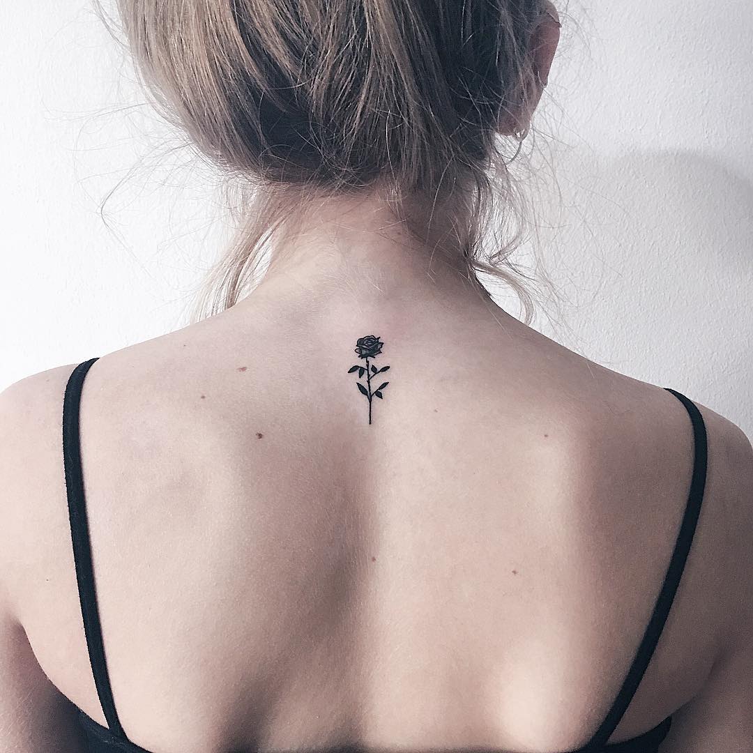 Minimalist rose tattoo on the back