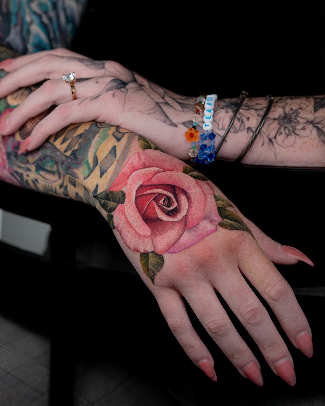 Stunning rose tattoo gracefully adorning the hand