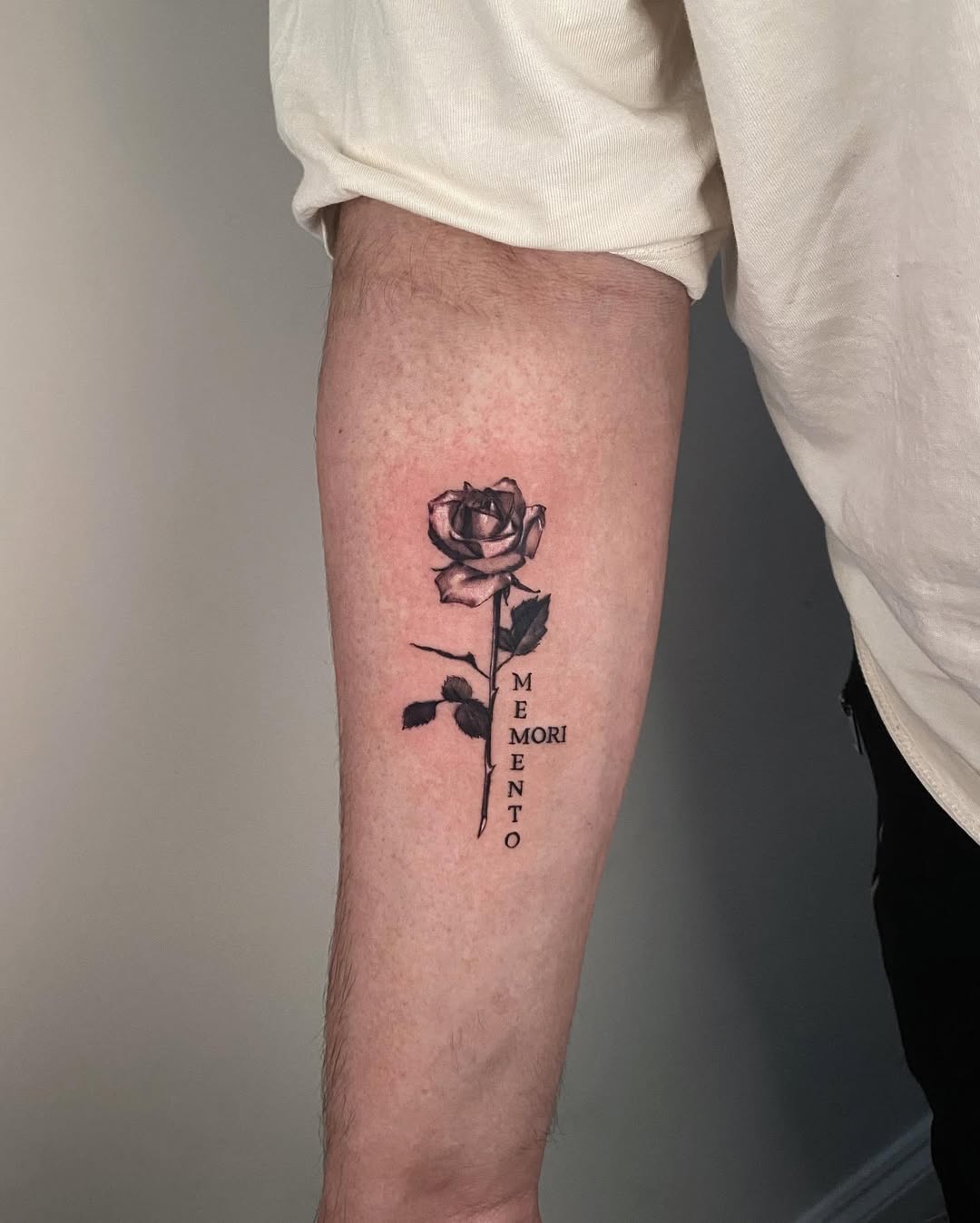 Bold rose tattoo with deep meaning