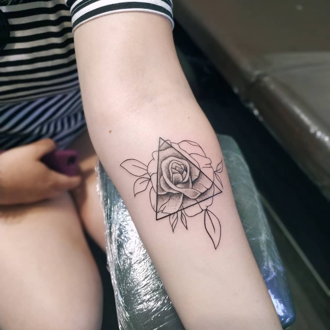 Stylish rose tattoo with geometric flair