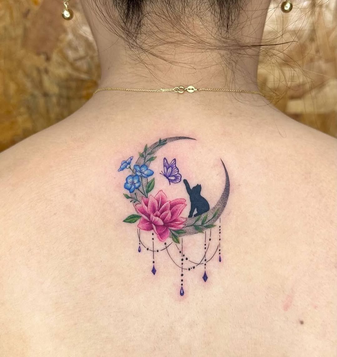 A whimsical moonlit rose tattoo design