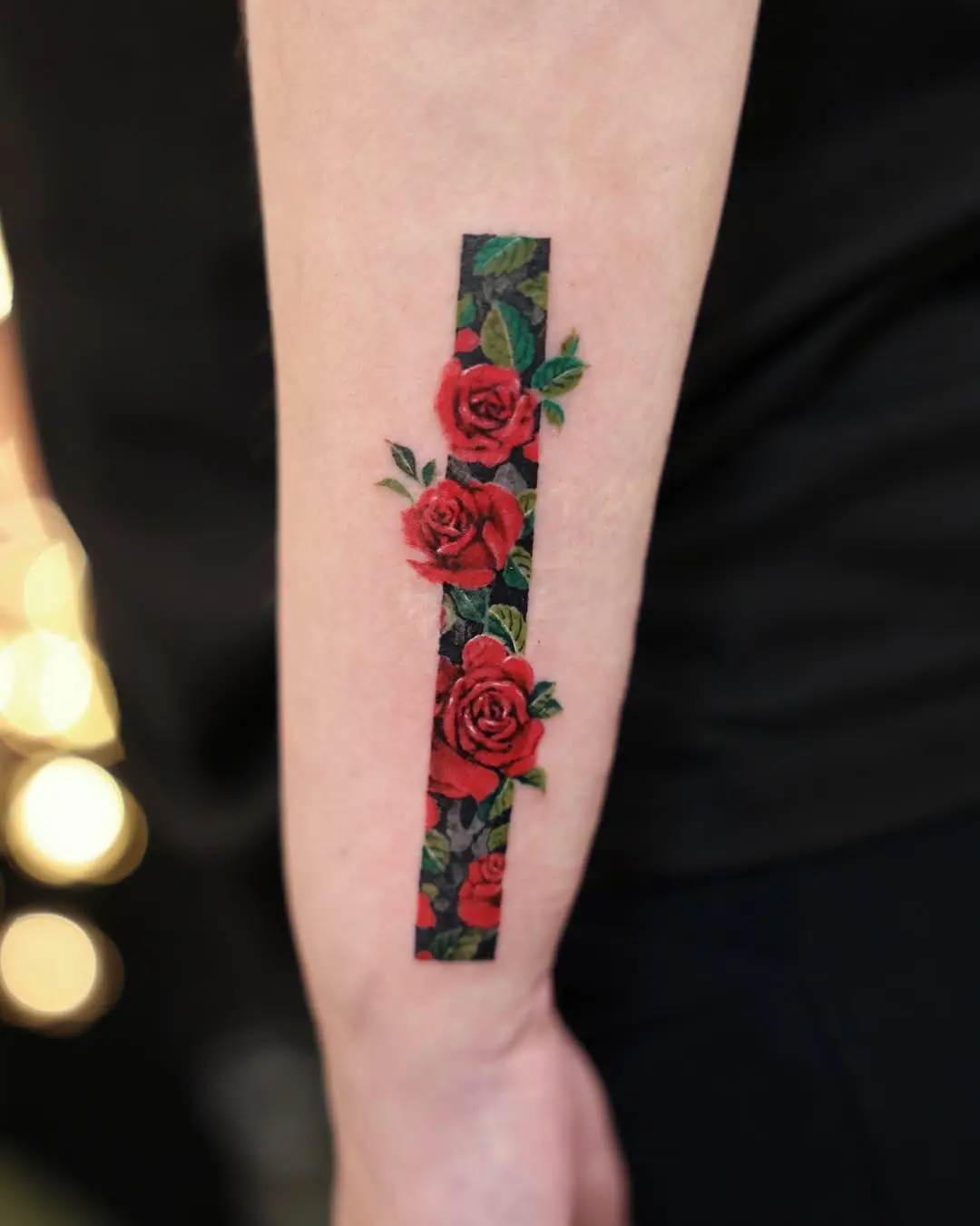 Stunning vertical rose tattoo design