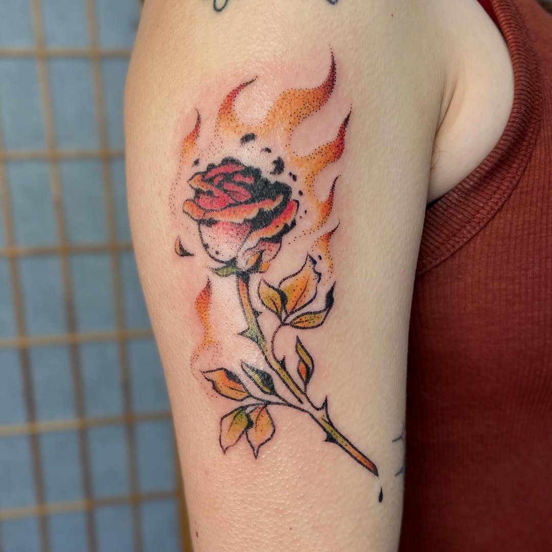 Vibrant rose tattoo wrapped in flames