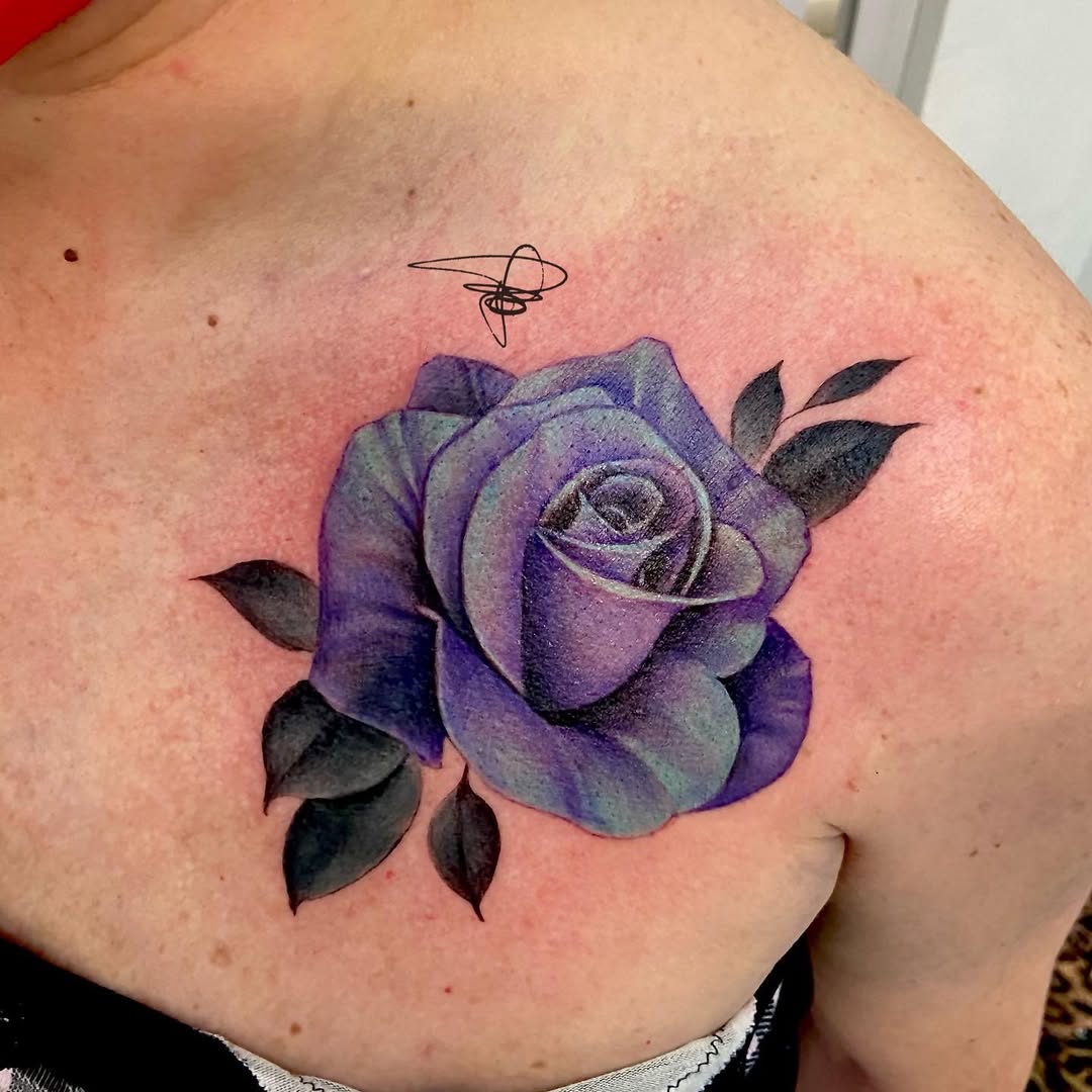 Stunning purple rose tattoo with rich detailing.