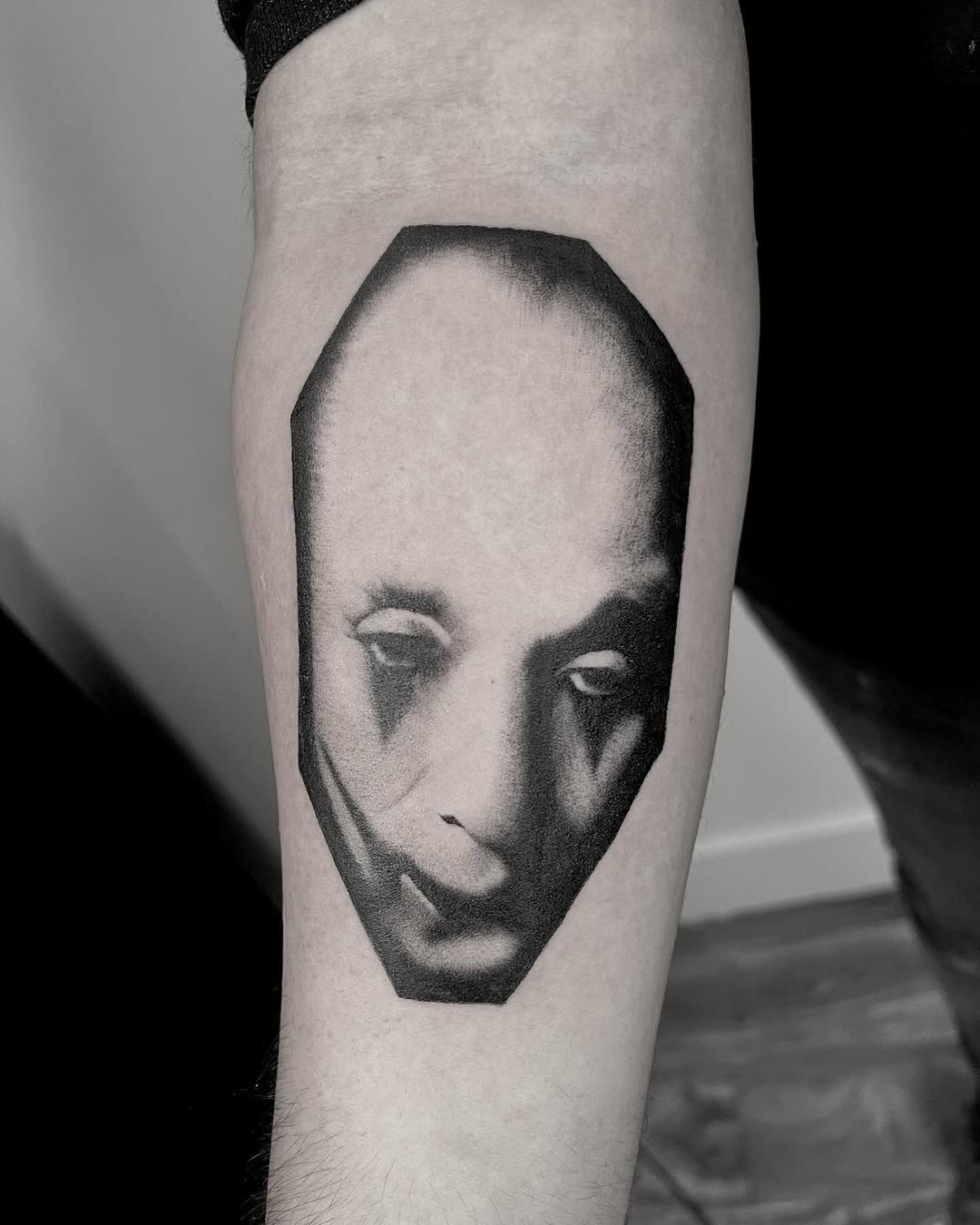 A haunting clown tattoo that evokes deep emotions