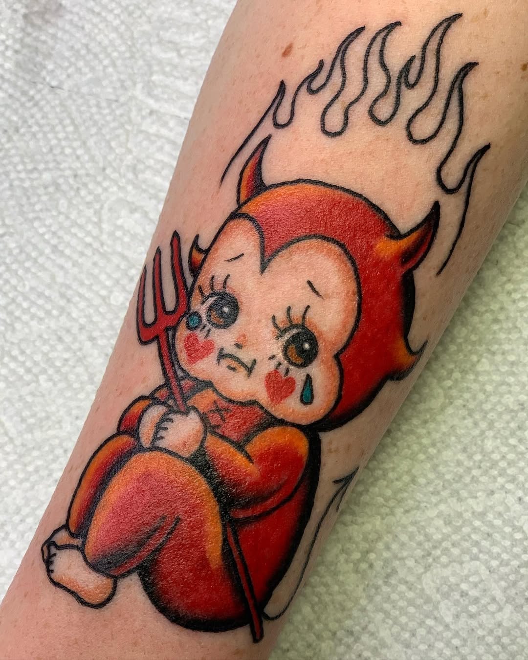 A whimsical yet melancholic devil tattoo design.