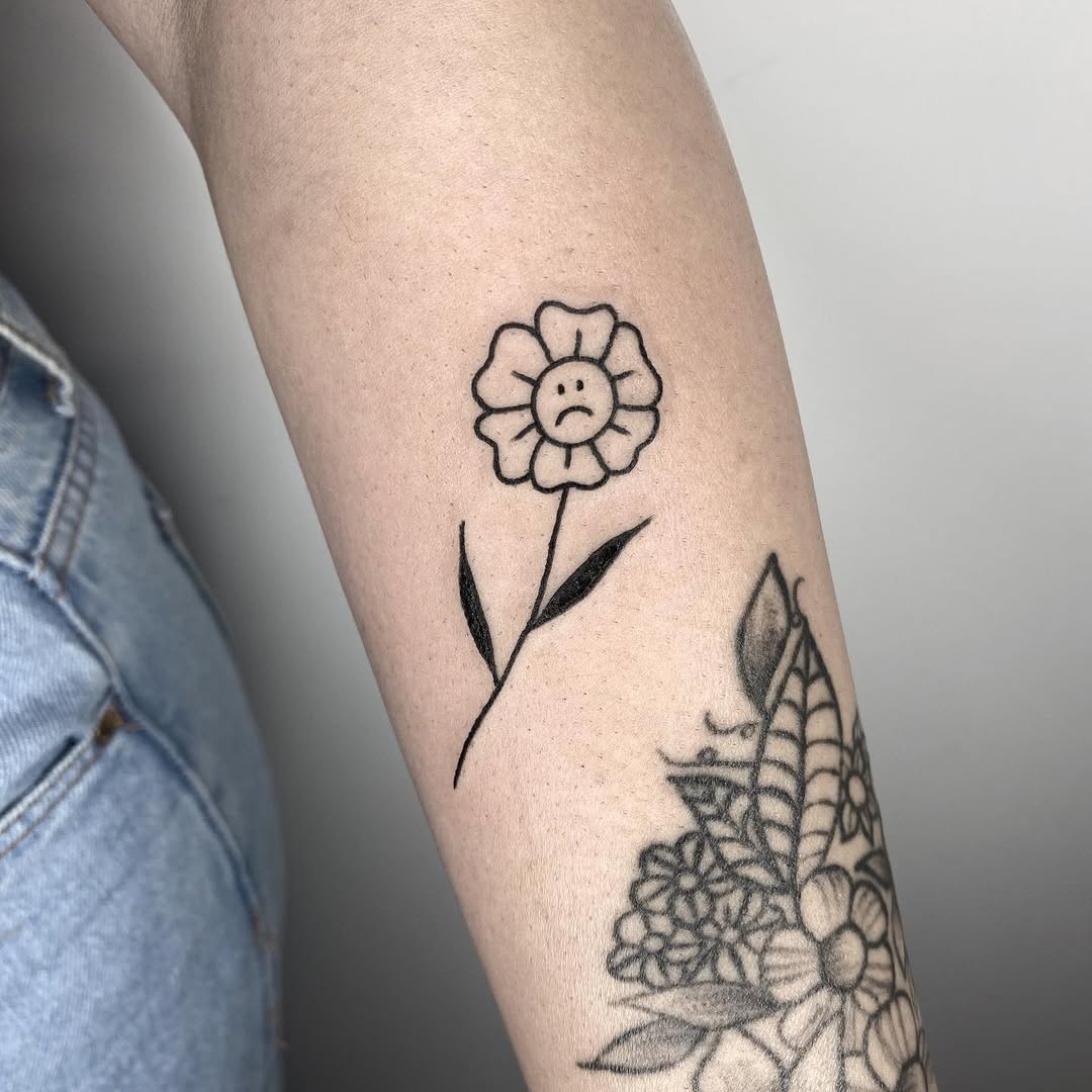 A melancholic flower tattoo expressing sadness