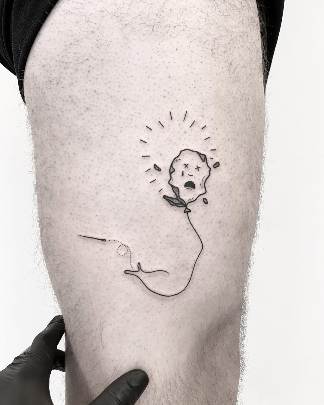 Whimsical tattoo blending sadness with nature