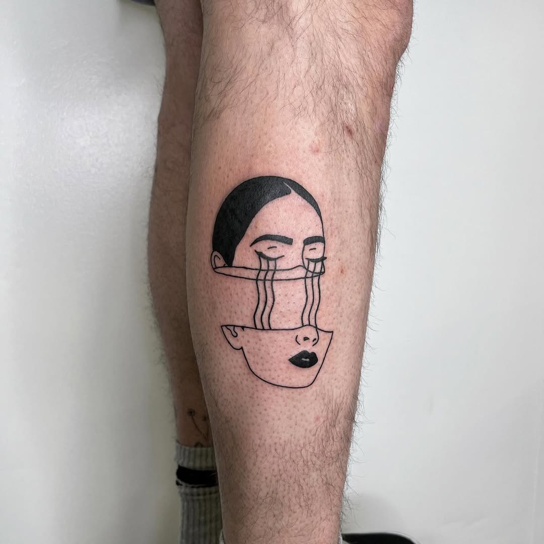 Expressive line art tattoo depicting sadness