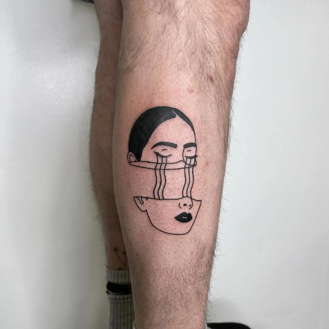 Expressive line art tattoo depicting sadness