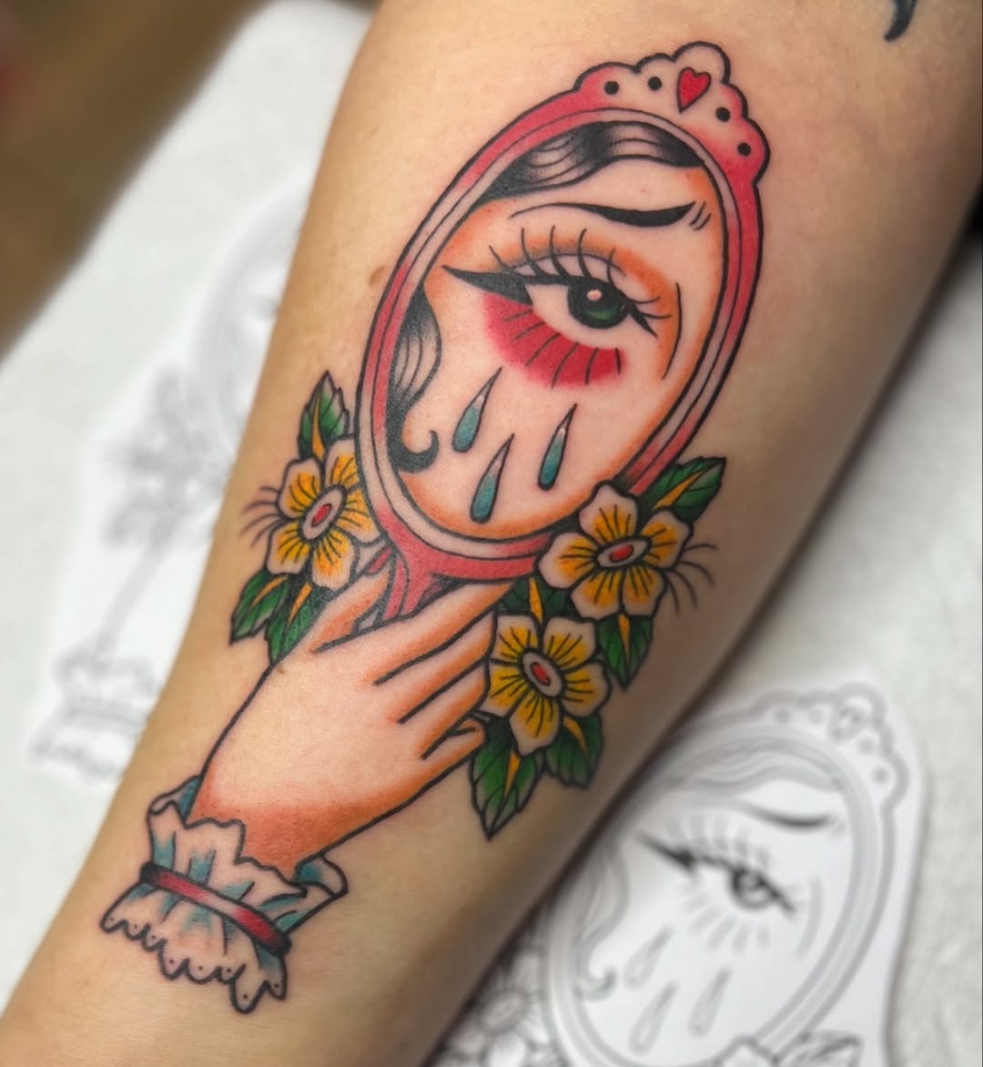 Emotional reflection in a vibrant tattoo design