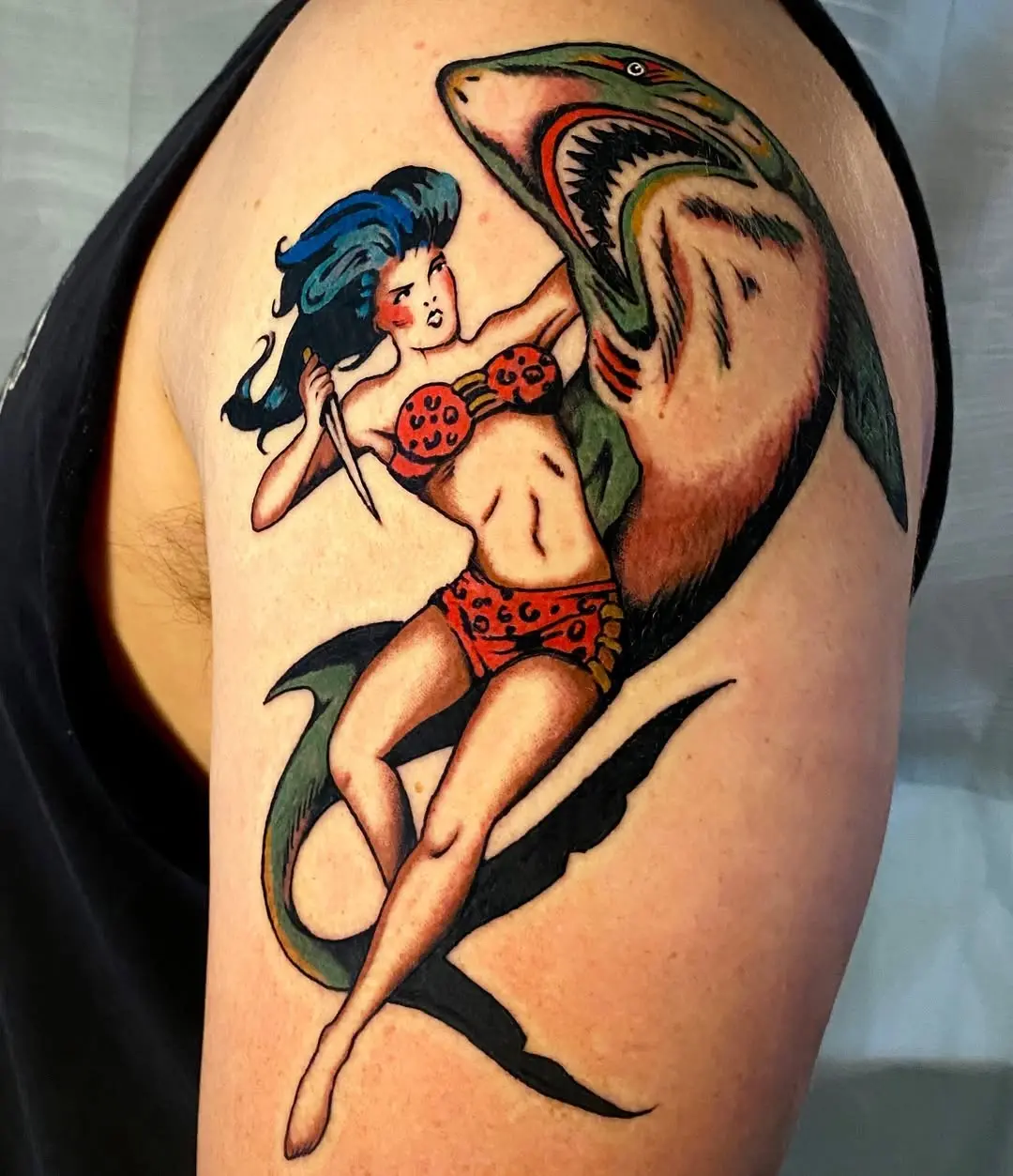 Bold and vibrant shark pinup tattoo design