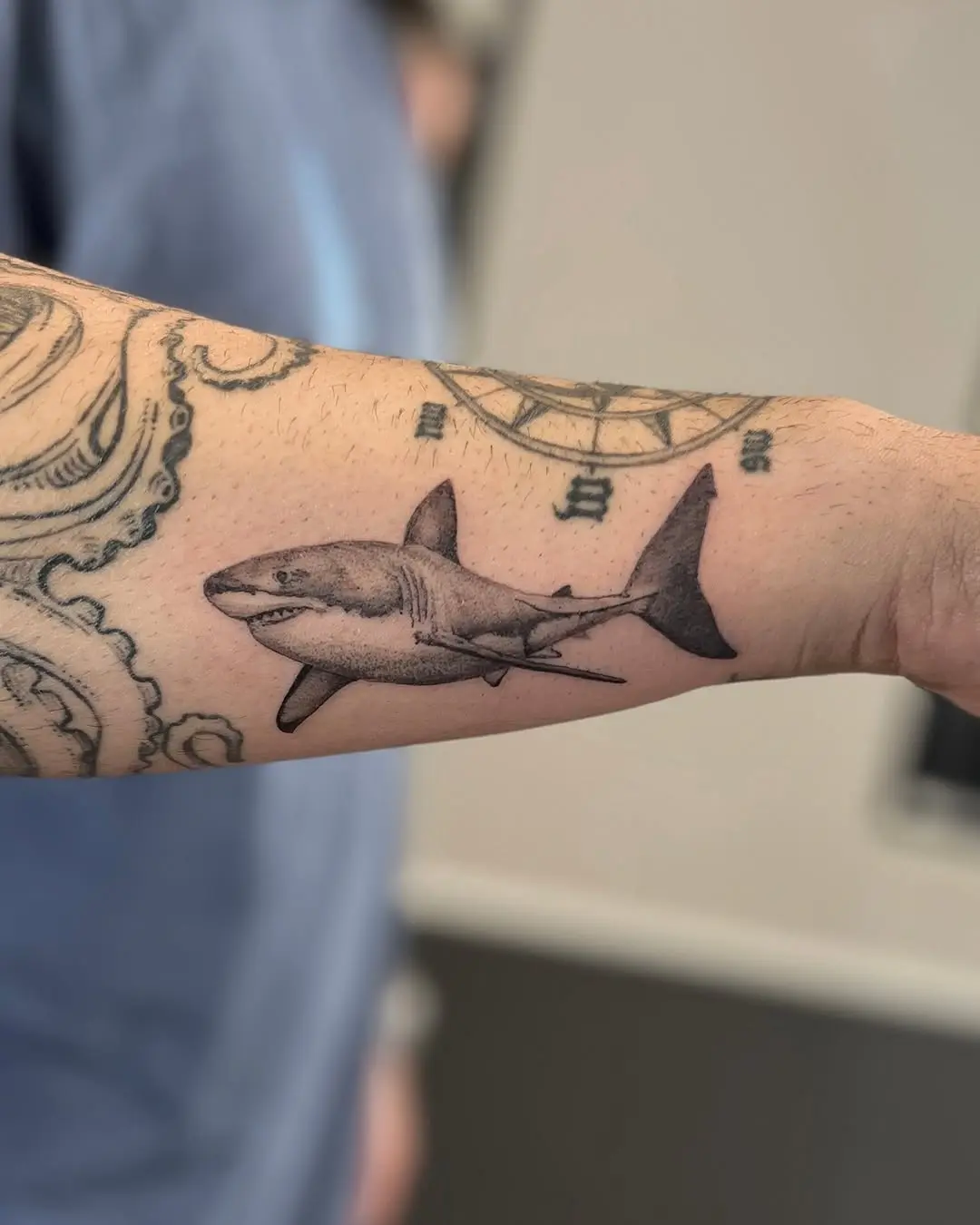 Dynamic Grey Shark Tattoo on Forearm