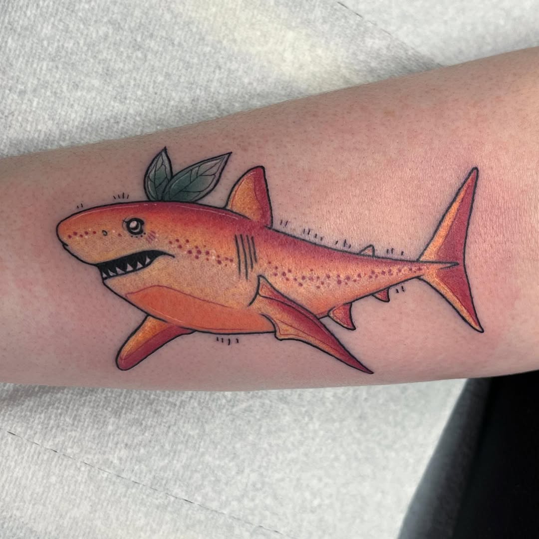 Playful shark tattoo with vibrant colors
