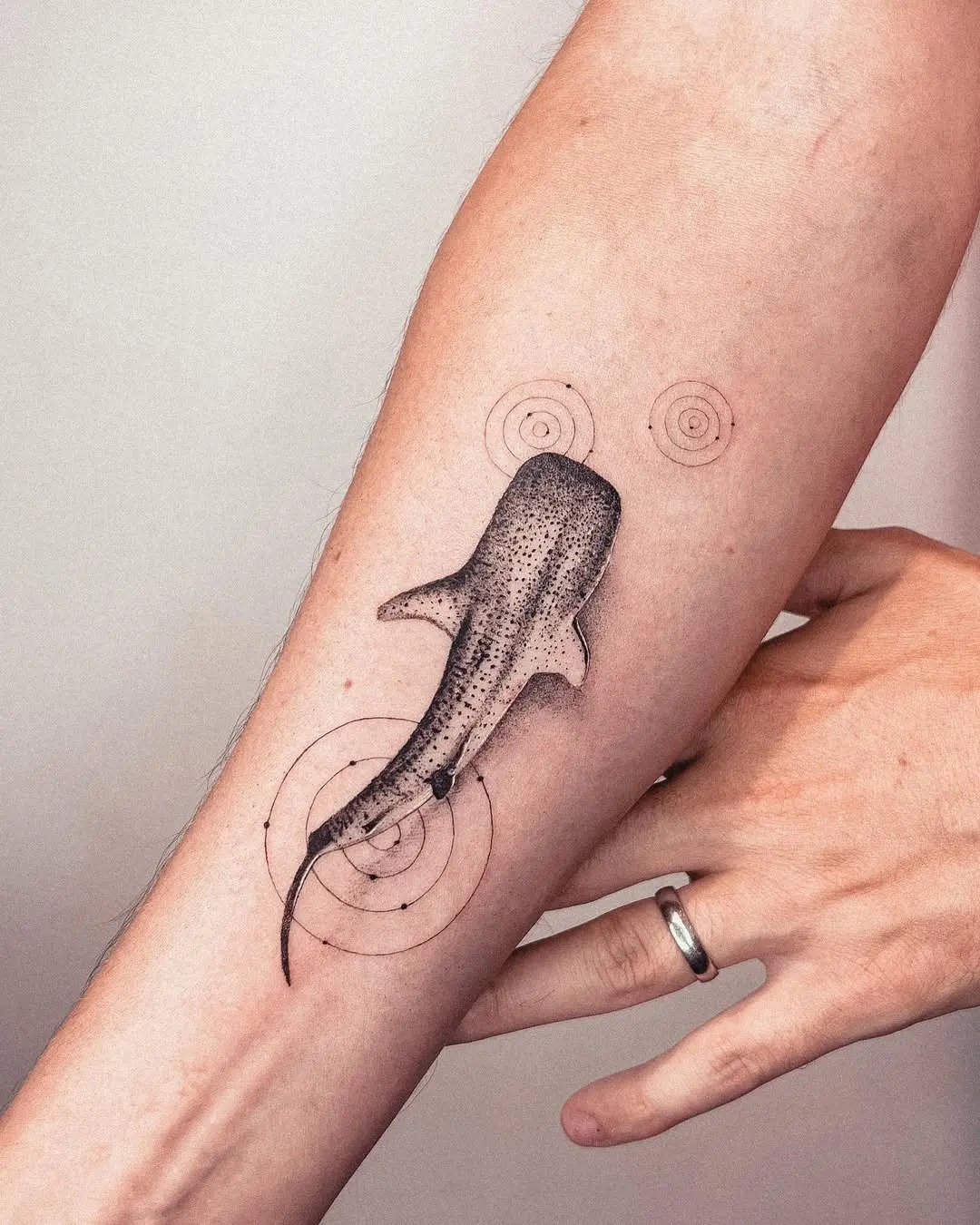 Intricate shark tattoo with mesmerizing circular patterns