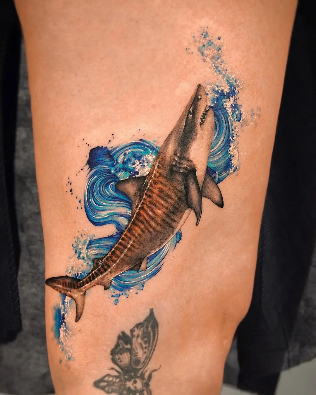 Stunning shark tattoo with dynamic water design