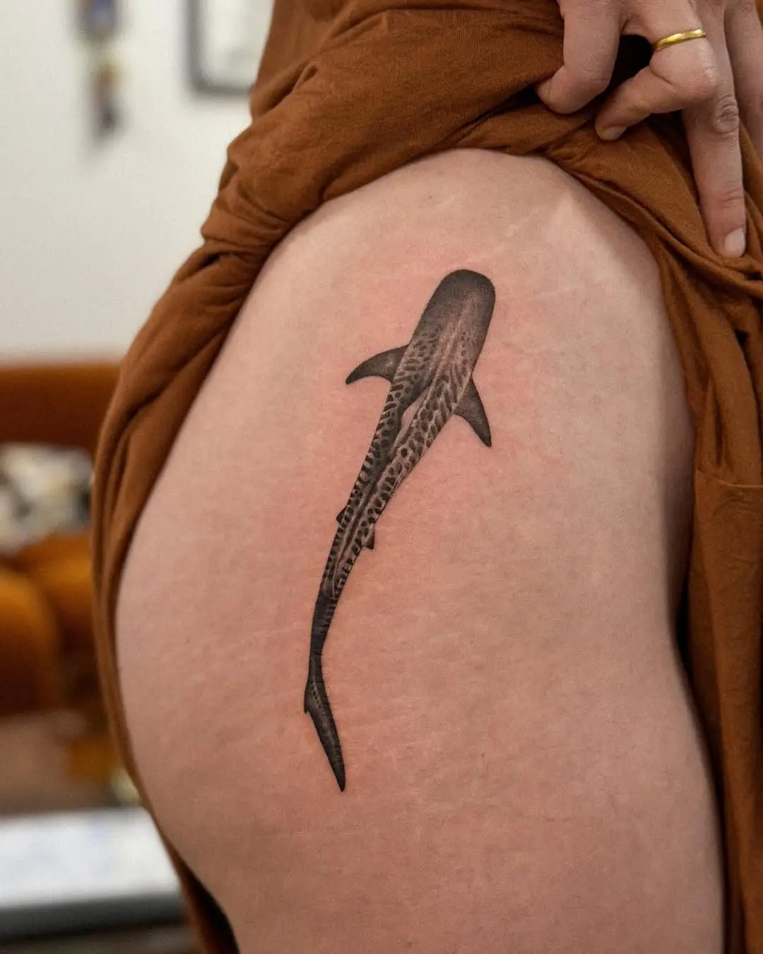 Elegant shark tattoo on the thigh