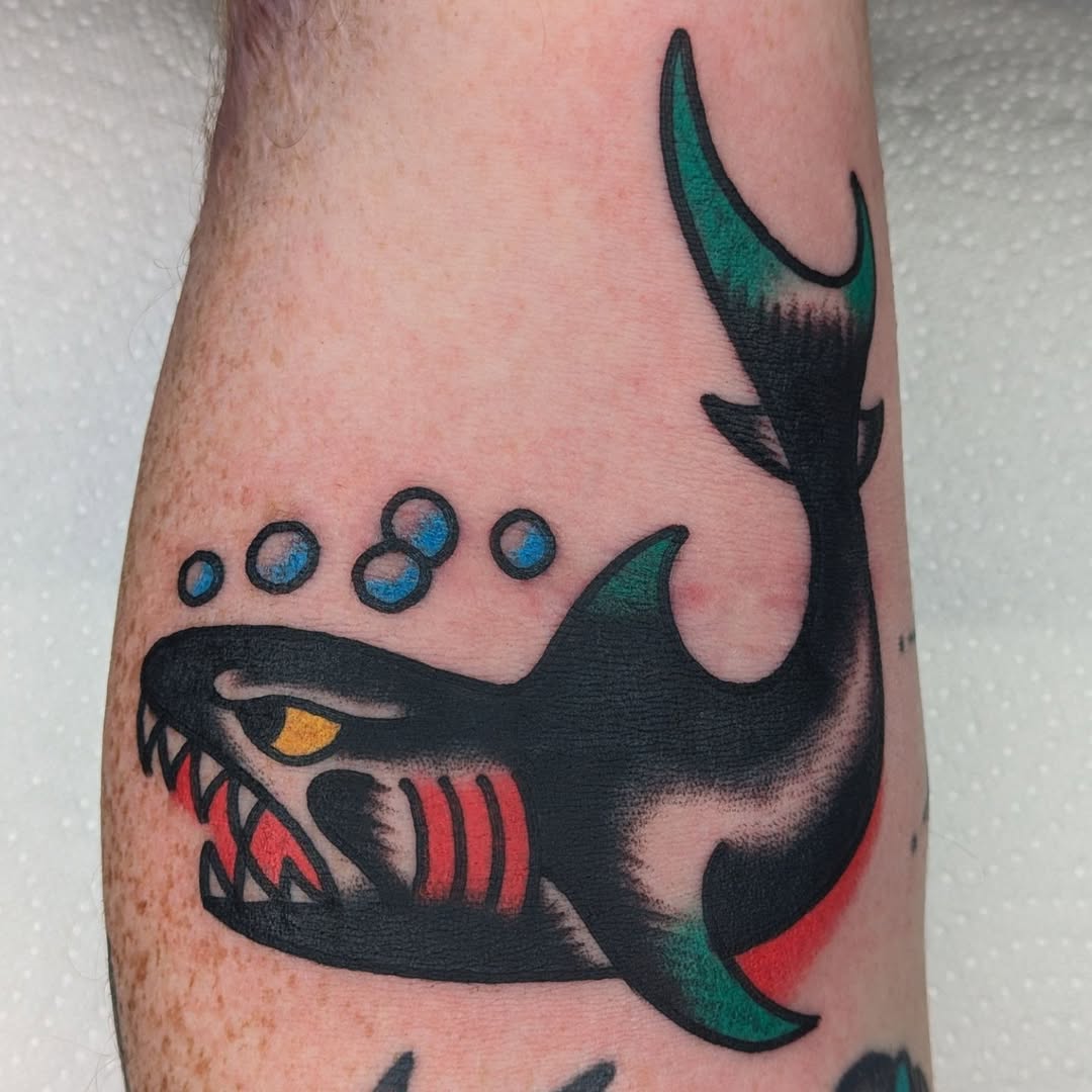 Stylish shark tattoo with vibrant colors
