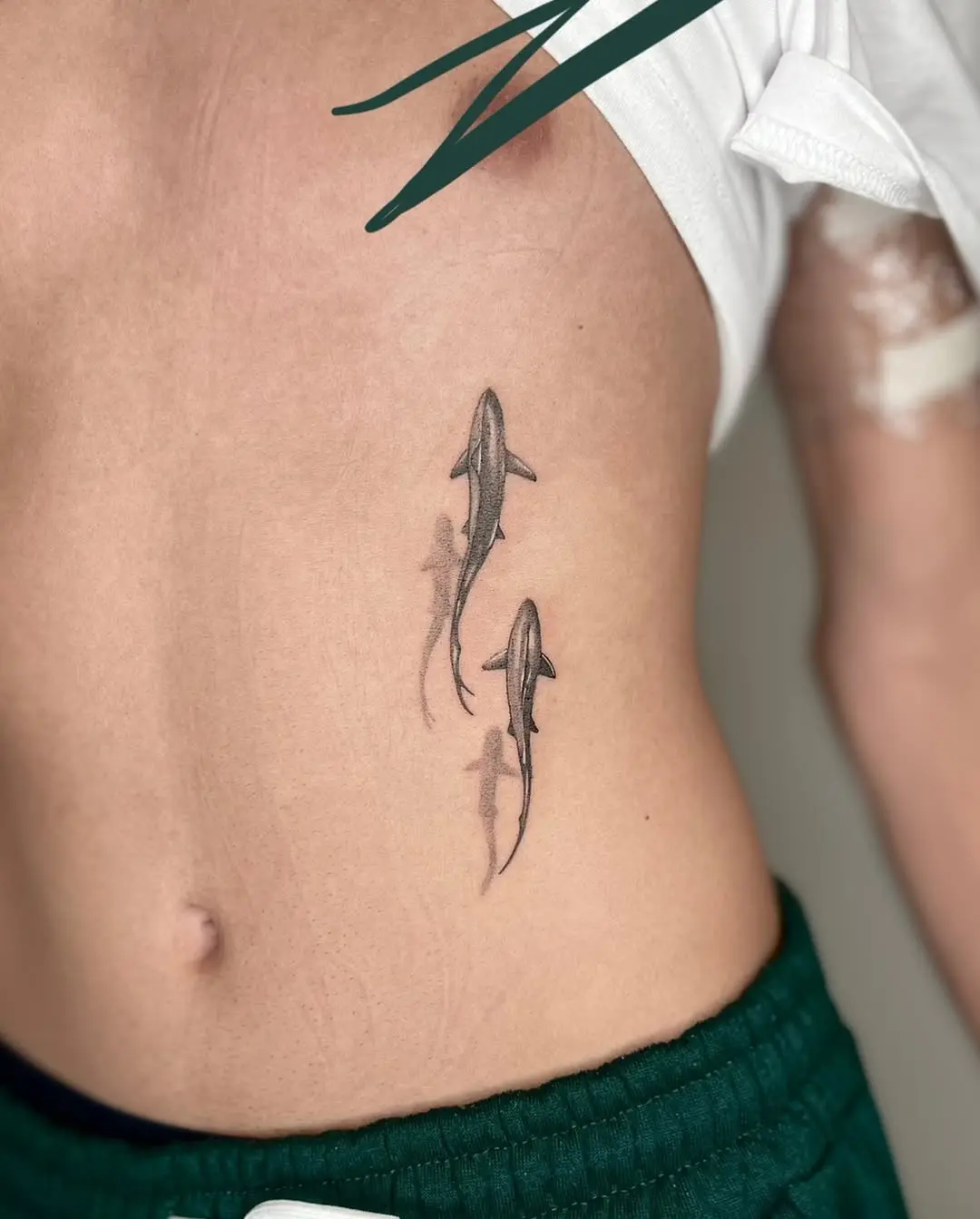 Minimalist Shark Tattoos on Ribs