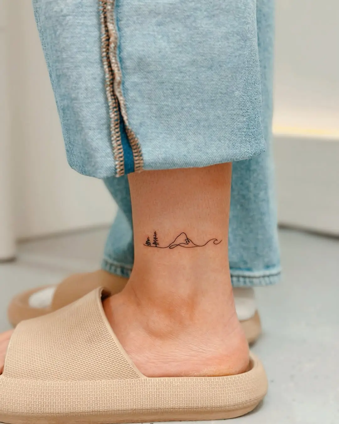 Nature-Inspired Small Tattoo on Ankle