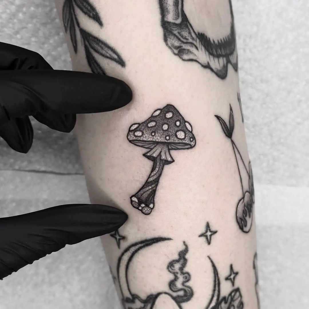 Charming small mushroom tattoo design for women