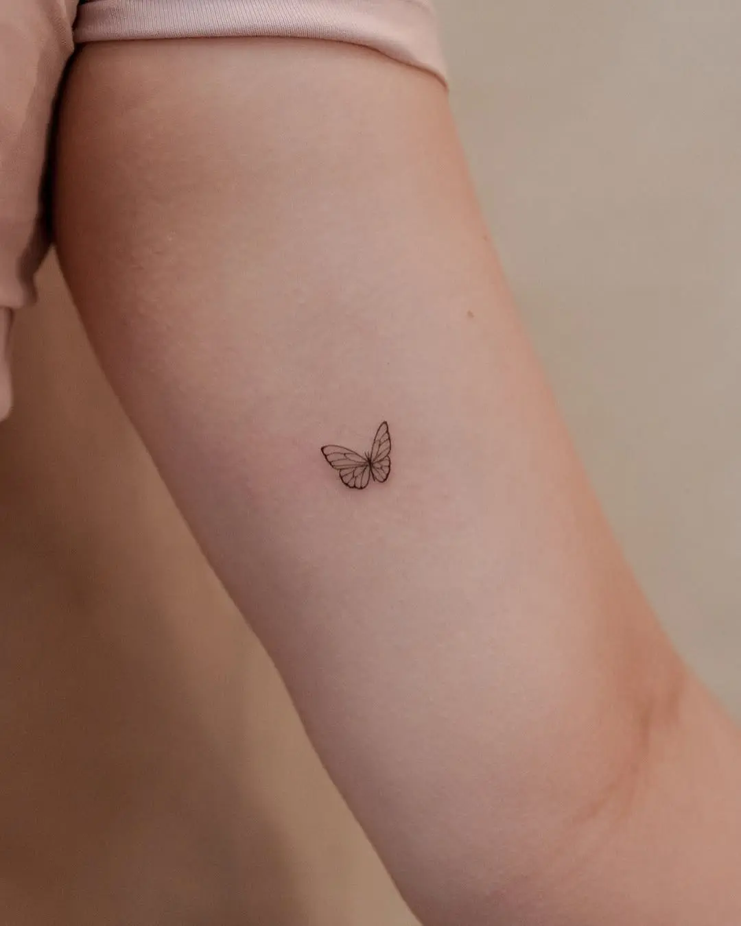 Elegant butterfly small tattoo for women