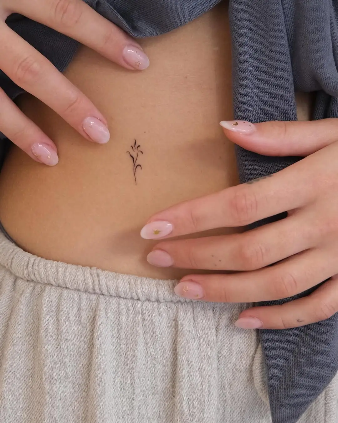 Delicate flower tattoo enhancing feminine style