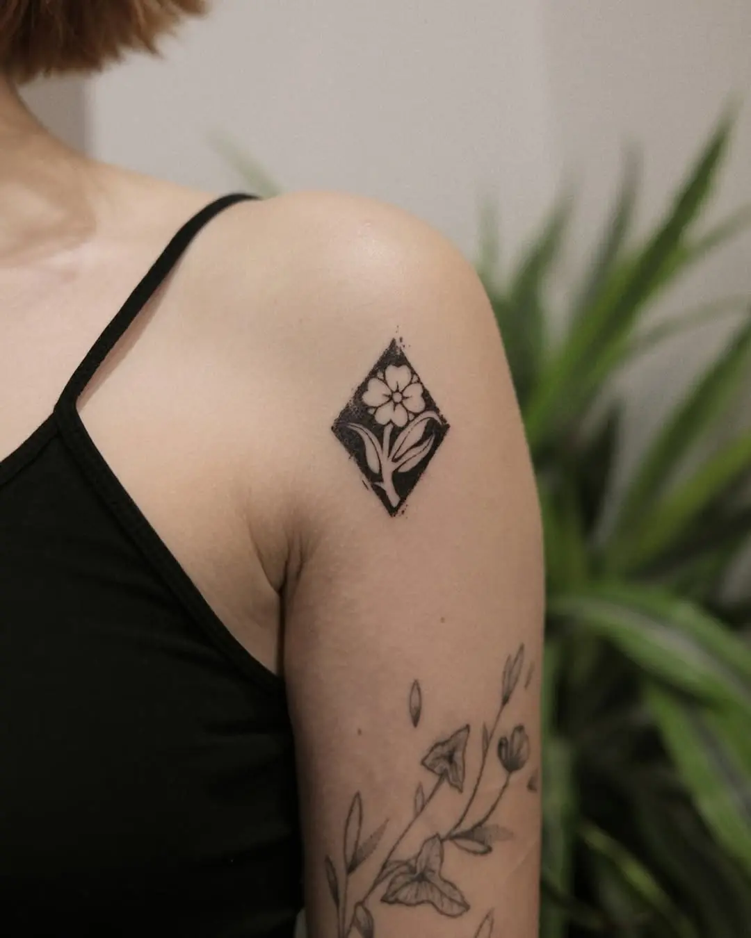 Charming diamond floral tattoo on shoulder