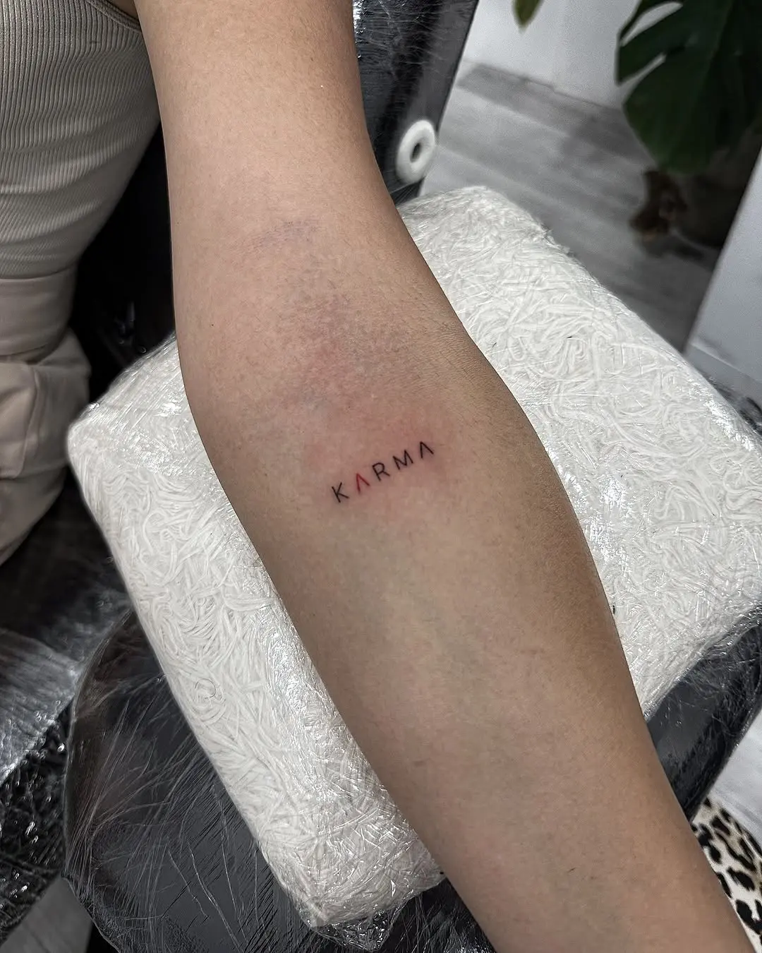 Minimalist 'Karma' Tattoo on Forearm