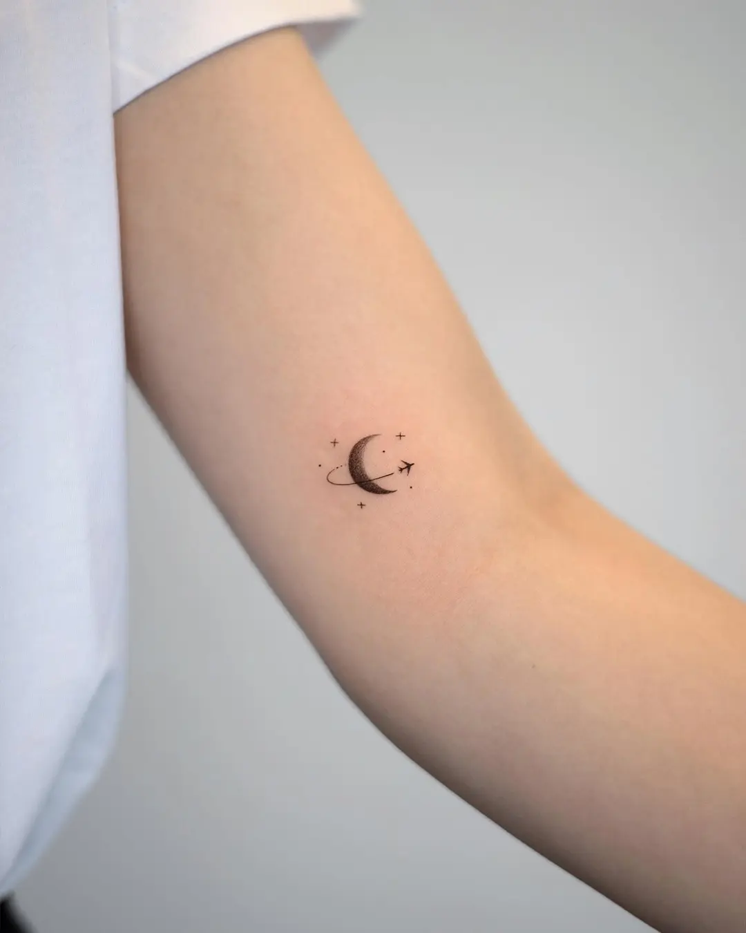 Delicate moon and stars tattoo concept