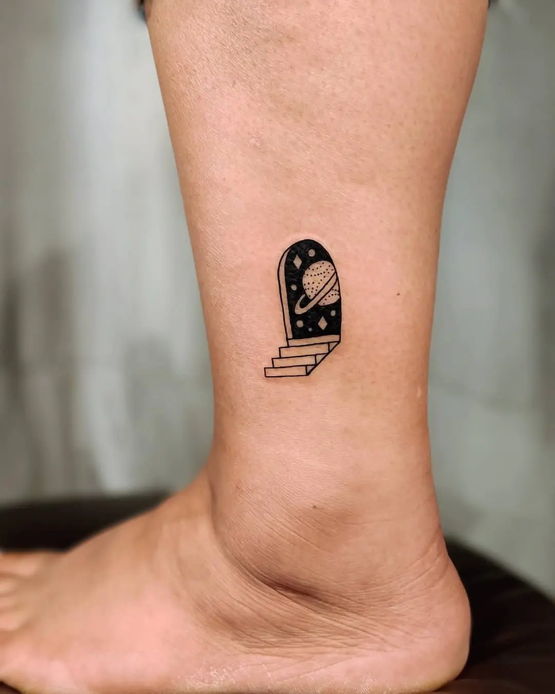 Whimsical door tattoo with planet design