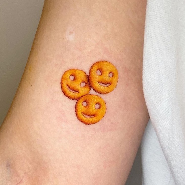 Charming smiley face food tattoos delightfully playful