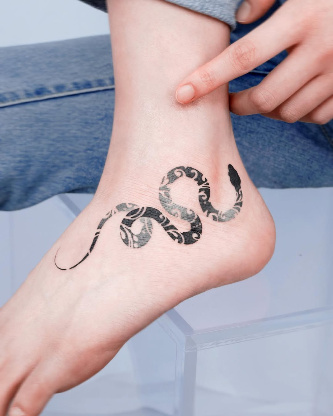 Elegant snake design wrapping around the ankle