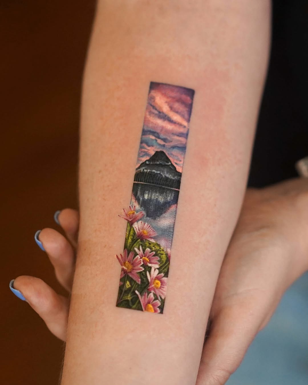 A mesmerizing mountain landscape tattoo design.