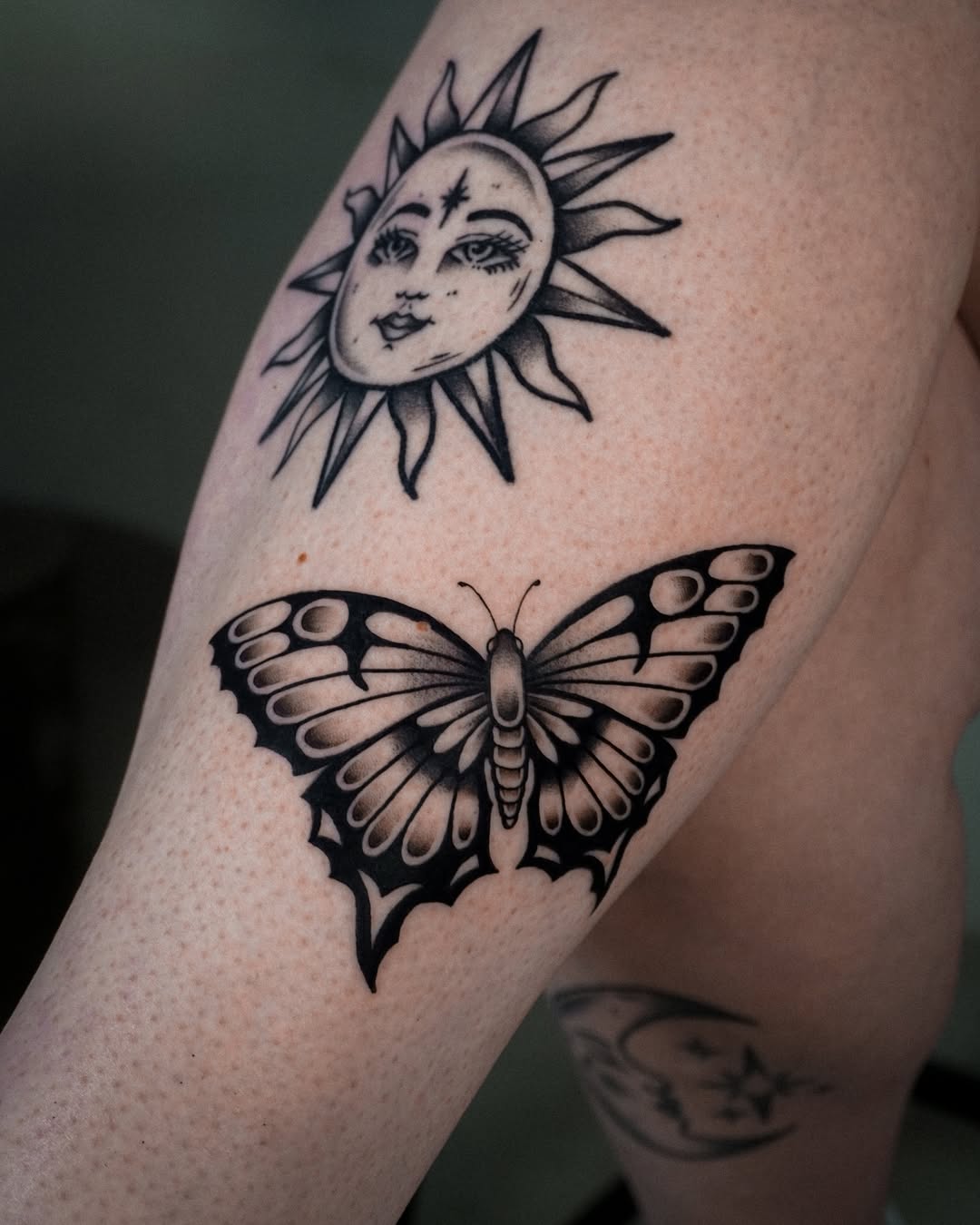 Elegant sun and butterfly tattoo design.