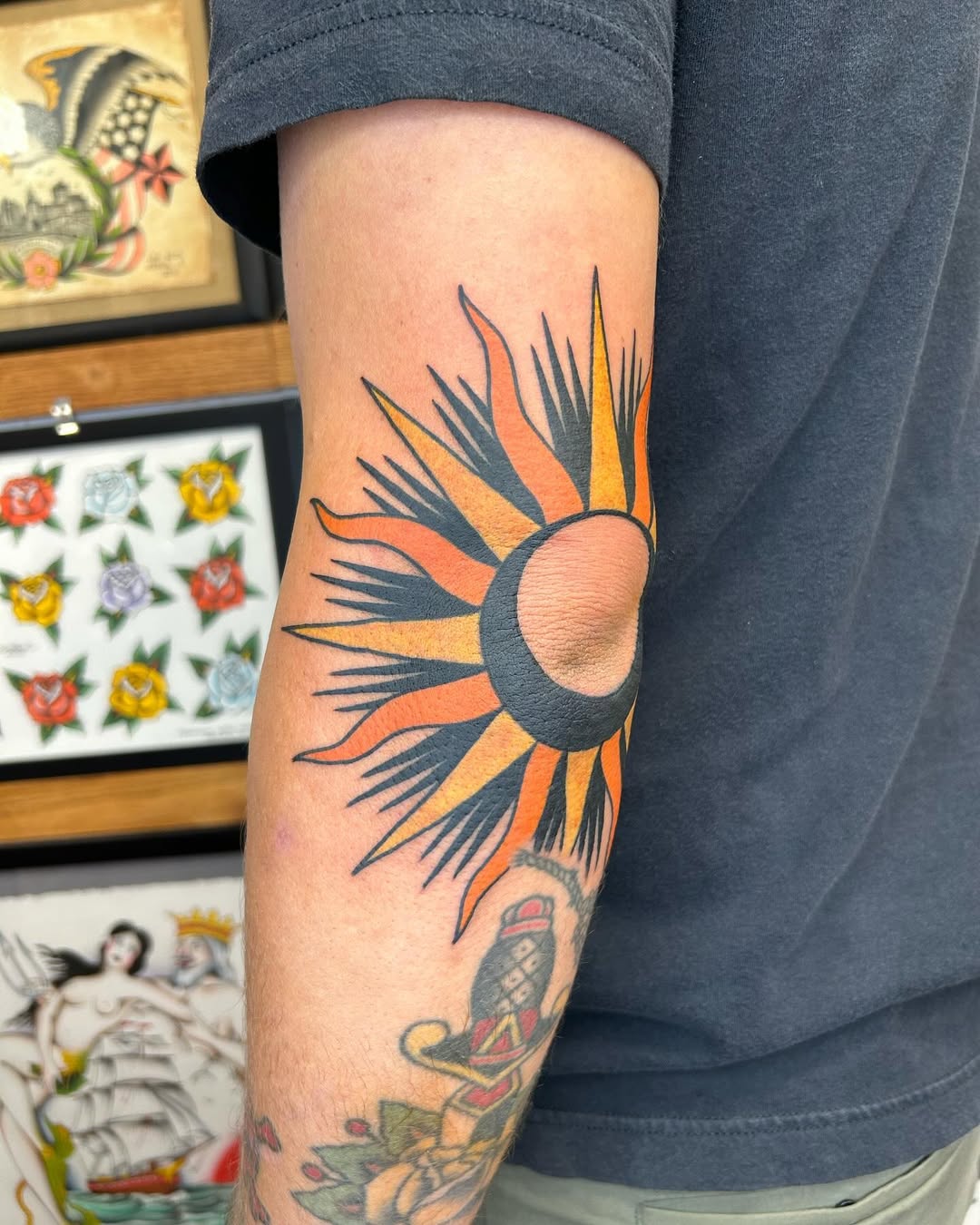 Vibrant Sun Tattoo with Bold Lines