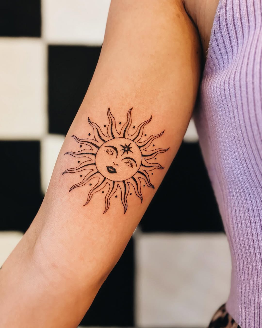 Delightful sun tattoo with expressive features