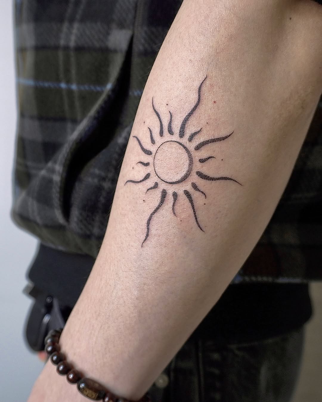 Minimalist Sun Tattoo on Arm