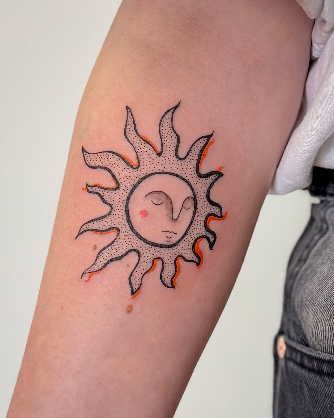 Charming sun tattoo for a radiant vibe