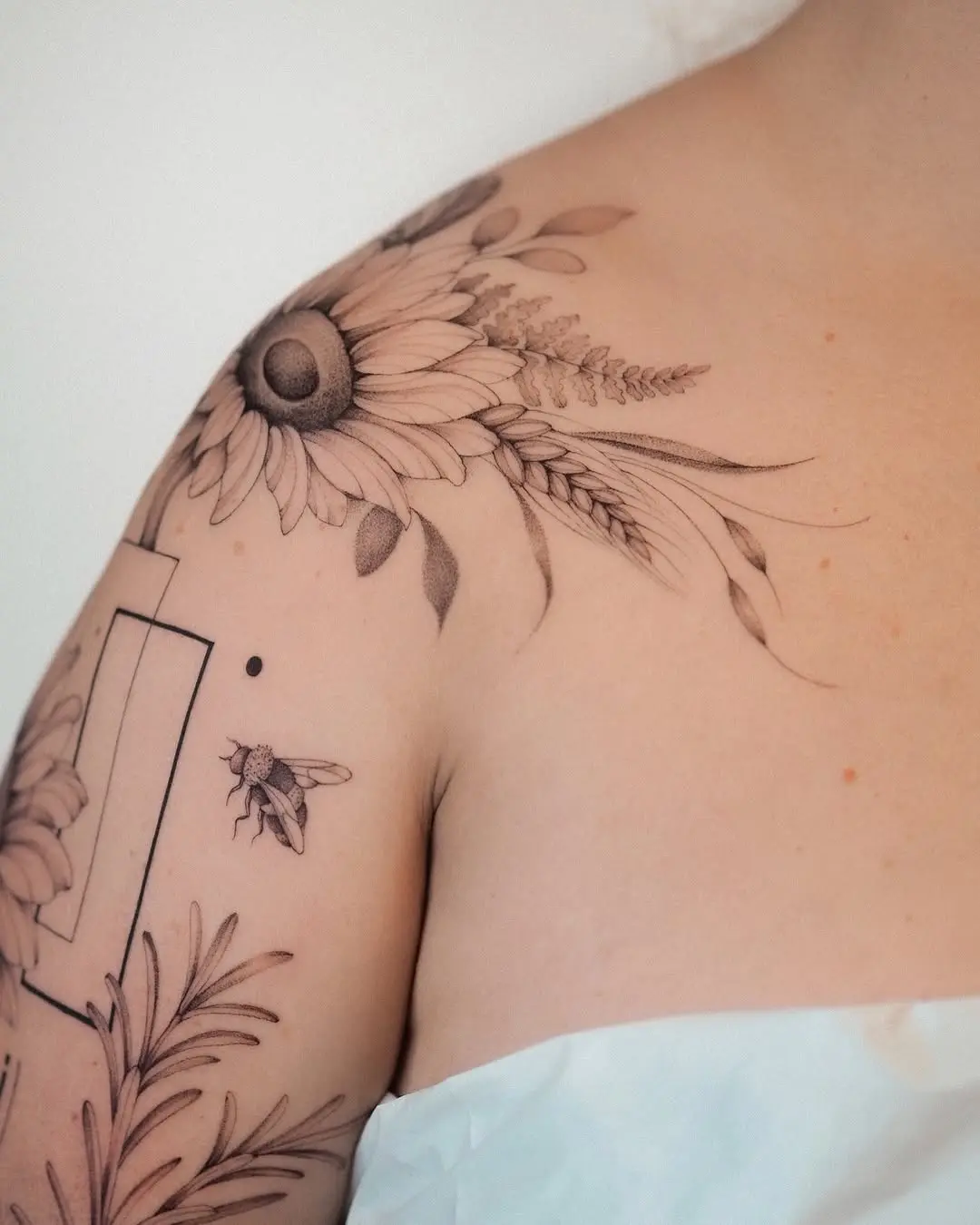 Beautiful sunflower tattoo design on shoulder