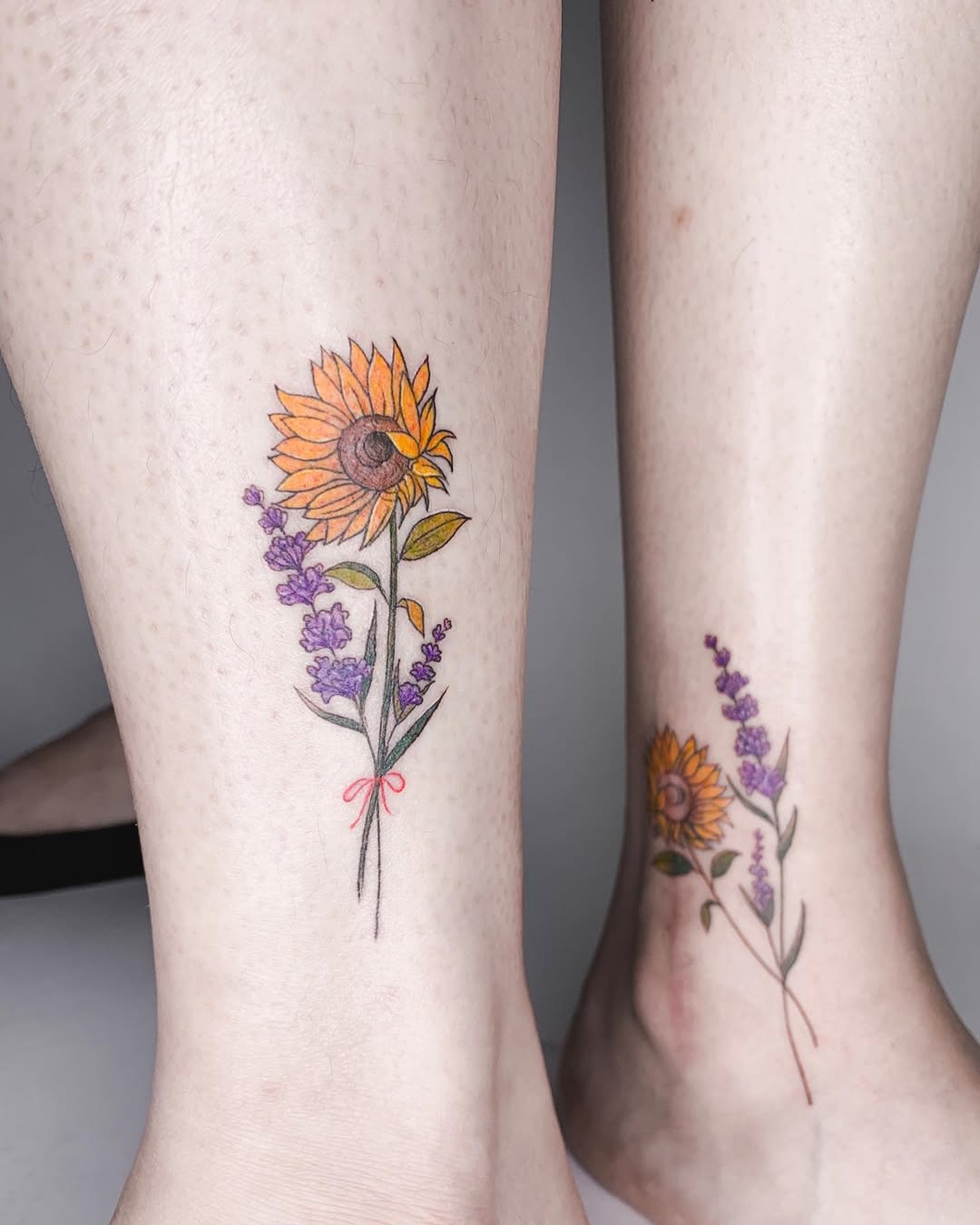 Delicate sunflower tattoo with lavender accents