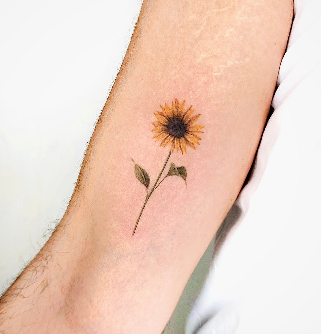 Beautiful sunflower tattoo on the inner arm