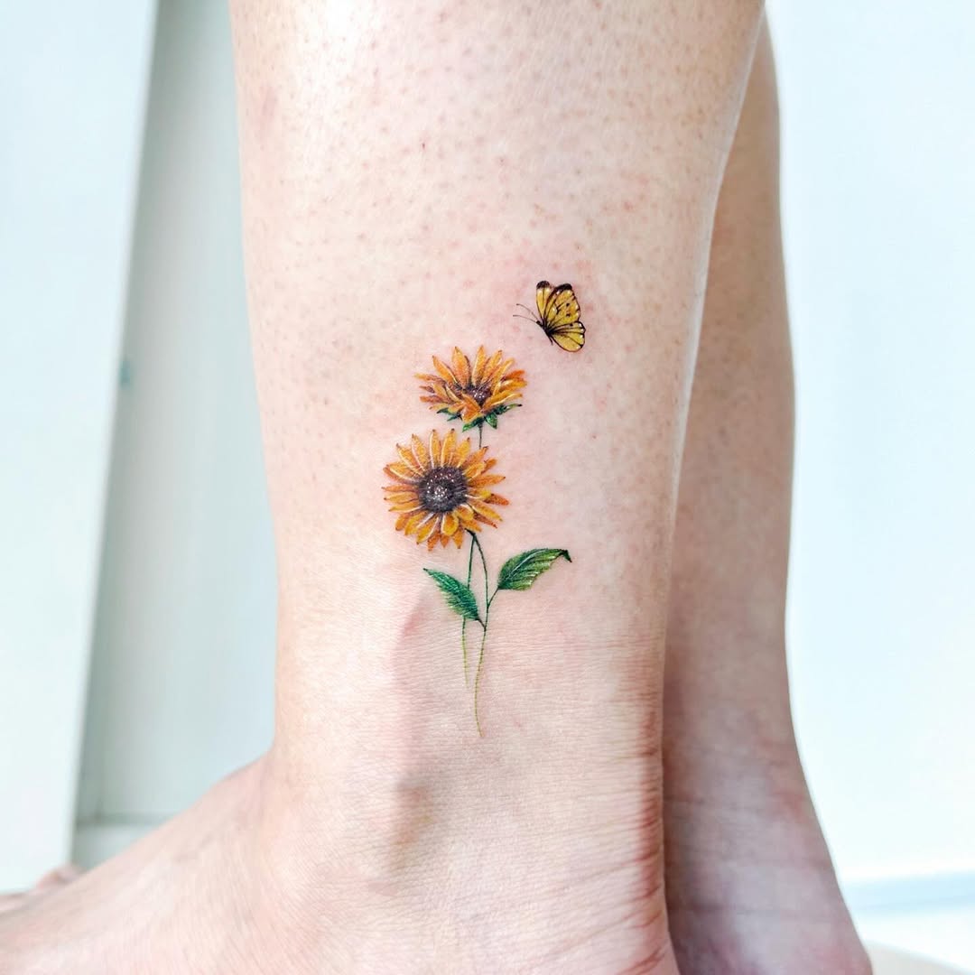 Charming sunflower tattoo with delicate butterfly accent