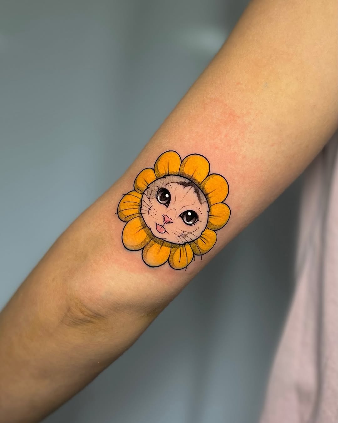 Playful sunflower tattoo with expressive face